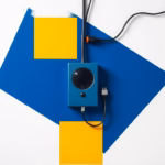 Suprematist abstract painting by Kazimir Malevich featuring a wired home alarm system. Minimalist composition of bold navy blue and vibrant yellow geometric shapes on a stark white background. Flat textures, sharp edges, avant-garde electrical concept. ##no humans##, ##no text##.
