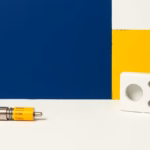 Suprematist abstract painting in the style of Kazimir Malevich featuring vintage ceramic cartridge fuses and a porcelain fuse holder. Minimalist composition of bold navy blue and vibrant yellow geometric shapes on a stark white background. Flat textures, sharp edges, avant-garde electrical concept. No humans, no text overlay.