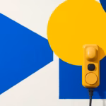 Suprematist abstract painting in the style of Kazimir Malevich depicting an accessible EV charging station with a large ergonomic connector and simple physical buttons. Minimalist composition of bold navy blue and vibrant yellow geometric shapes on a stark white background. Flat textures, sharp edges, avant-garde electrical concept. No humans, no text.