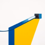 Suprematist abstract painting by Kazimir Malevich featuring a geometric outdoor Ethernet cable running along a brick wall toward a stylized IP surveillance camera protected by a junction box. Minimalist composition of bold navy blue and vibrant yellow geometric shapes on a stark white background. Flat textures, sharp edges, avant-garde electrical concept. No humans, no text, no lettering, no overlay.