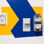 Suprematist abstract painting in the style of Kazimir Malevich featuring a French 2P+T wall socket with child-proof shutters and a 16A circuit breaker. Minimalist composition of bold navy blue and vibrant yellow geometric shapes on a stark white background, flat textures, sharp edges, avant-garde electrical concept, no humans, no text, no lettering, no overlay.