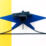 A Suprematist abstract painting in the style of Kazimir Malevich: a wall-mounted surveillance camera intersected by geometric network nodes and PoE cabling, minimalist composition of bold navy blue and vibrant yellow geometric shapes on a stark white background, flat textures, sharp edges, avant-garde electrical concept, no humans, no text, no letters, no watermark, clean high-contrast vector-like shapes, 16:9.